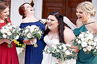 Bride and her maids laughing.